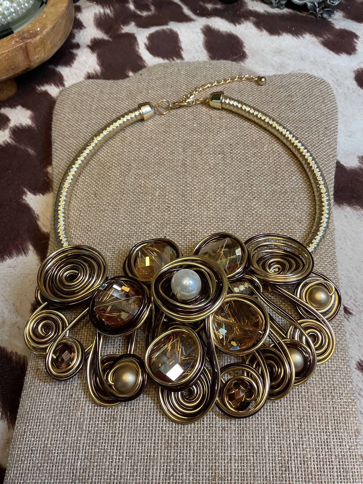 Large statement necklace with champagne color stones and pearls wrapped in gold wire