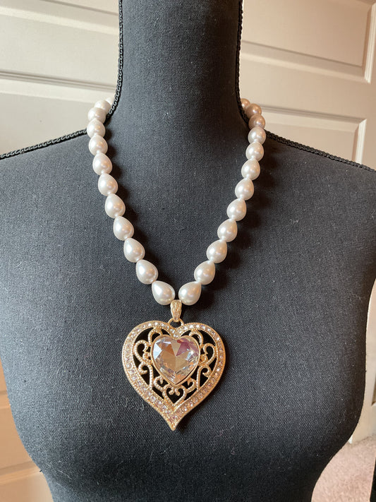 Large gold tone heart with beautiful clear stone pendant on pearls