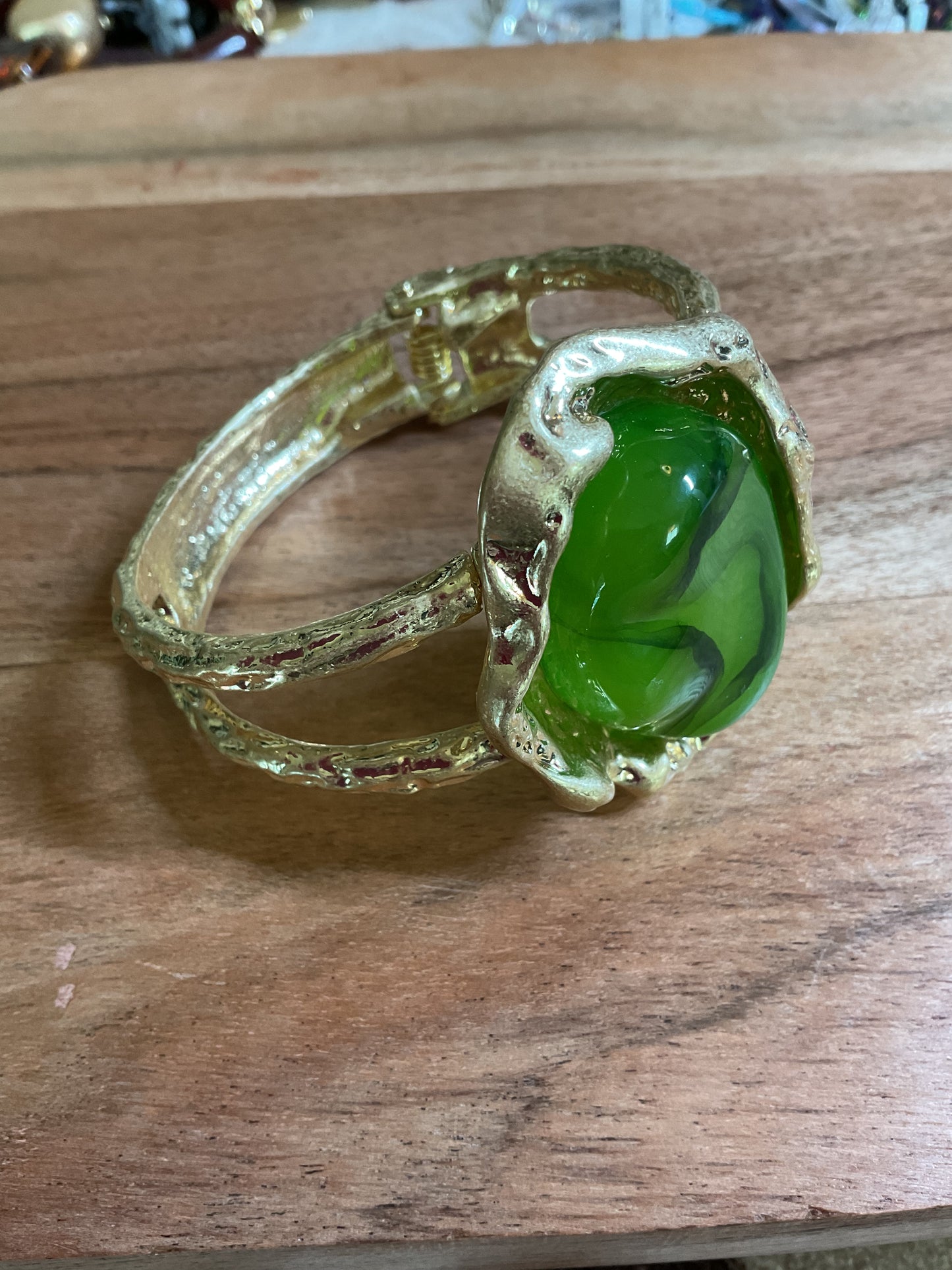 Green stone and gold statement bracelet