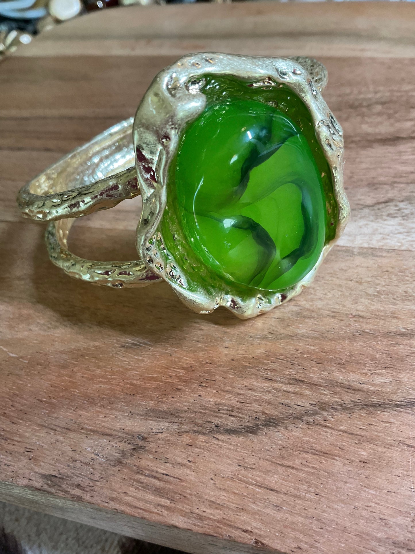 Green stone and gold statement bracelet