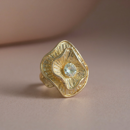 Gold stretch ring with large rhinestone