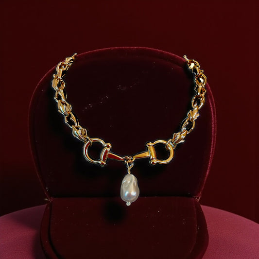 Chunky gold chain with horse bit and drop pearl