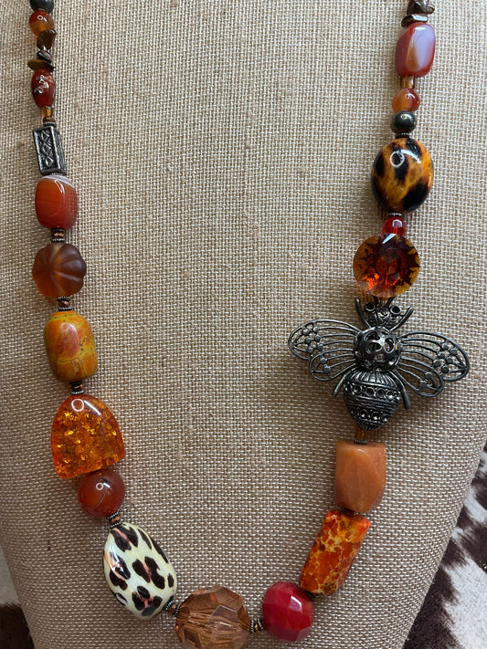 Orange and Amber beaded necklace with a bee pendant