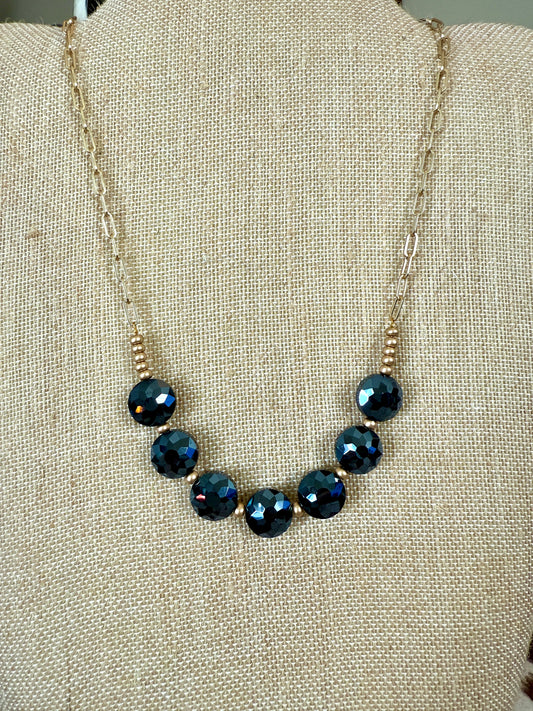 Dark blue beaded necklace with gold chain