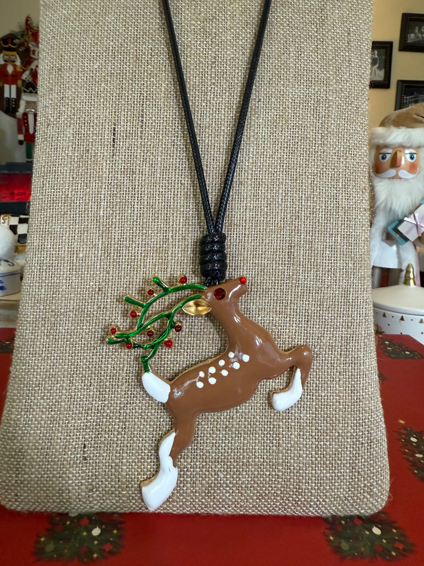 Large Reindeer pendant on a black cord necklace