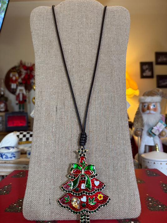 Large red Christmas tree pendant on a black cord necklace