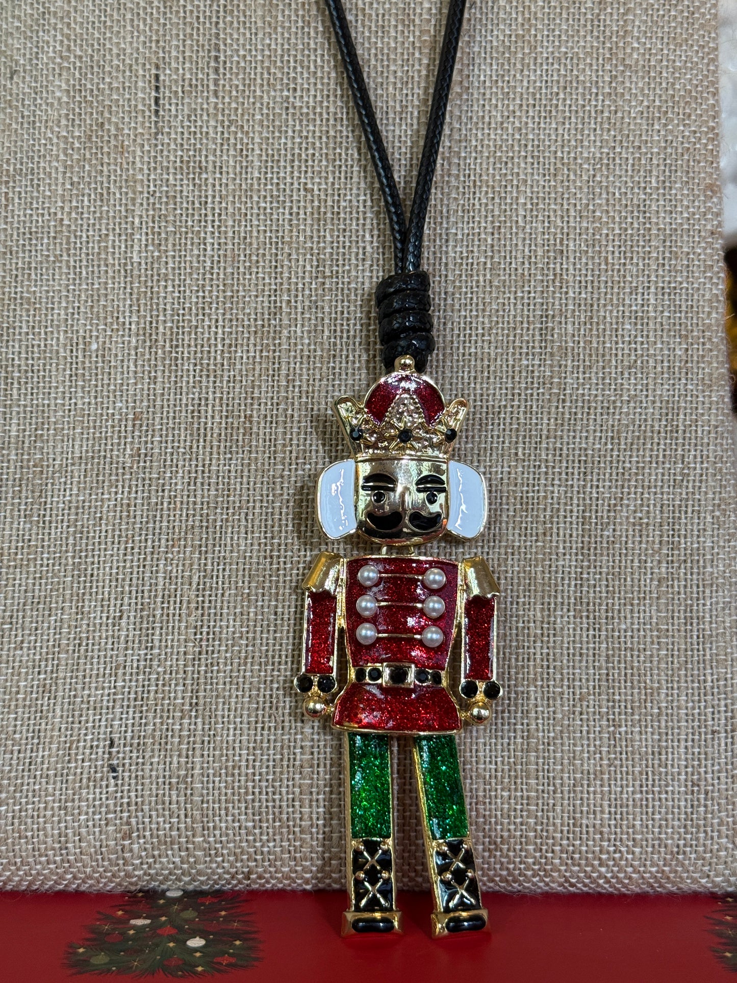 Large Nutcracker pendant necklace with a black cord