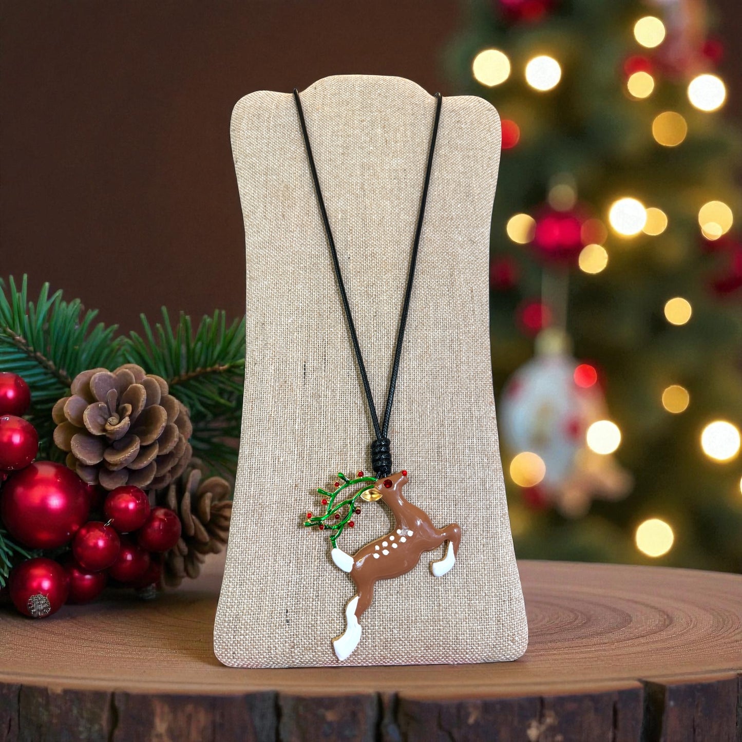 Large Reindeer pendant on a black cord necklace