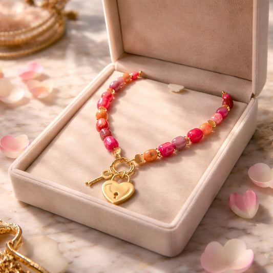 Multi color beaded necklace with gold tone heart locket pendant