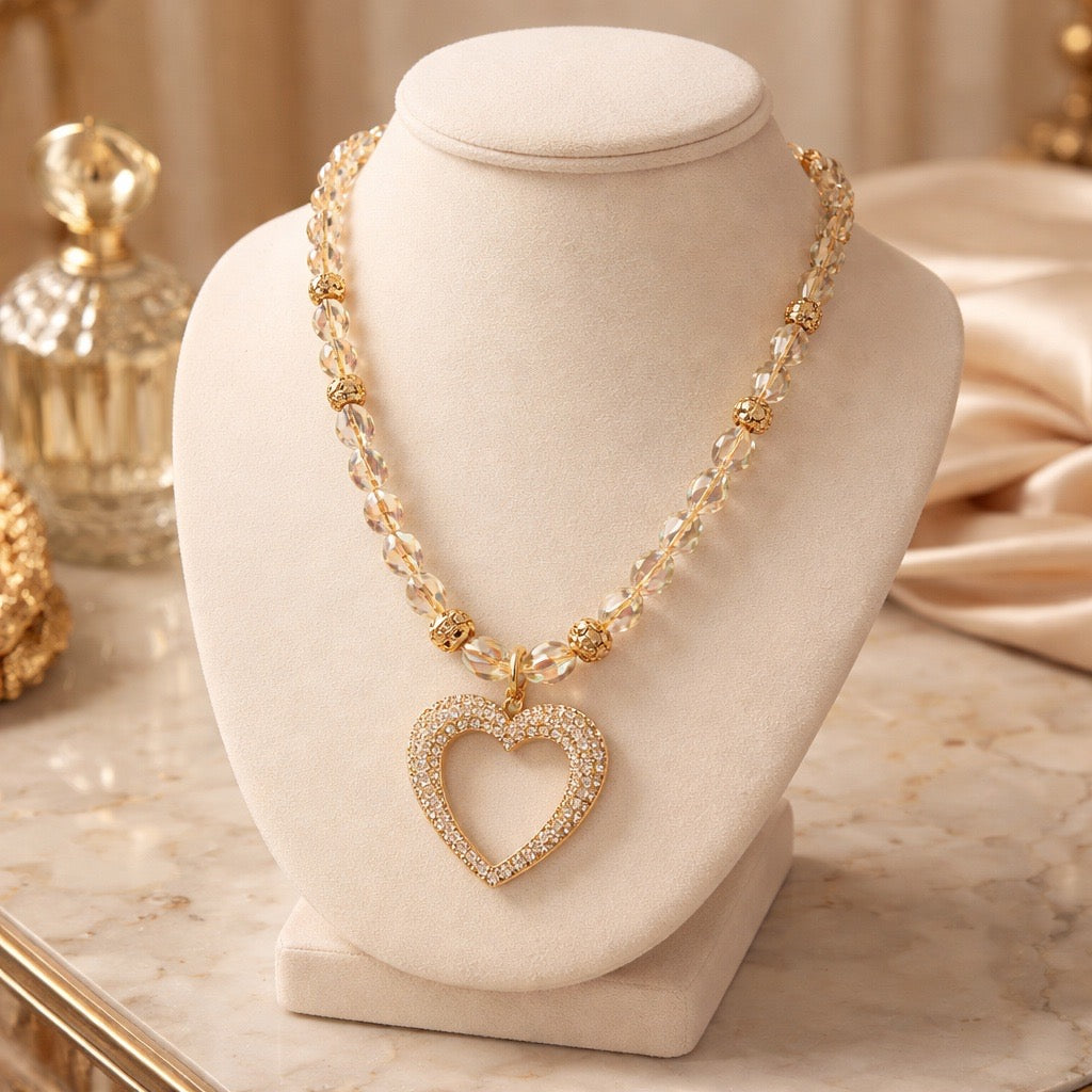 Rhinestone heart pendant strung on clear crystal beads