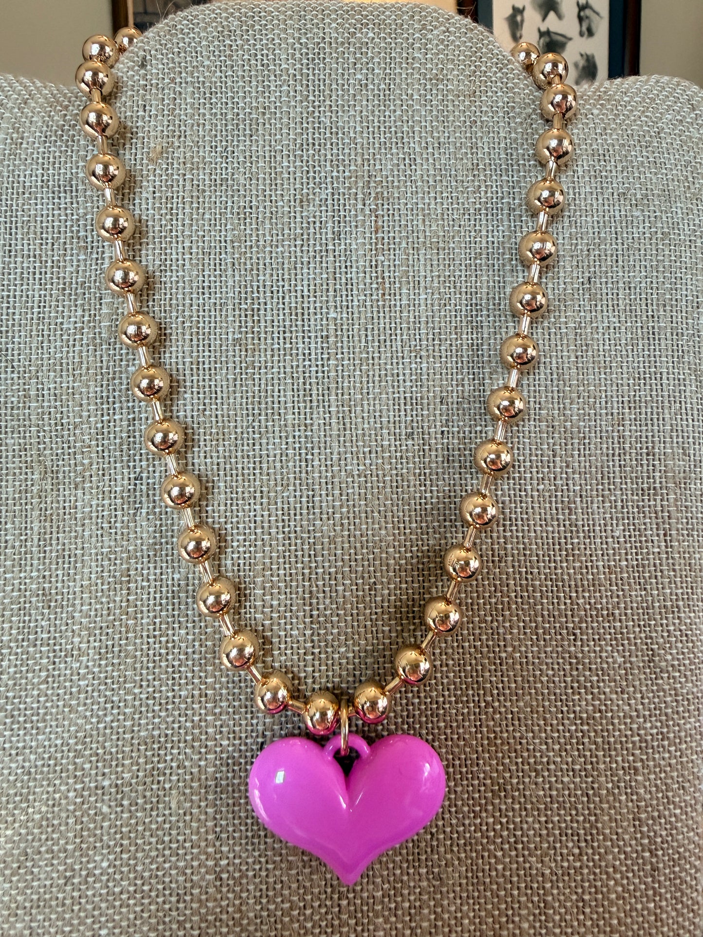Gold tone ball chain necklace with bright pink puffy heart pendant