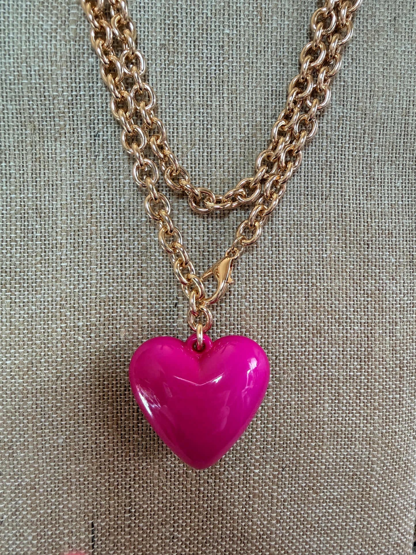Hot PInk  puffy heart pendant on Long gold tone chain.