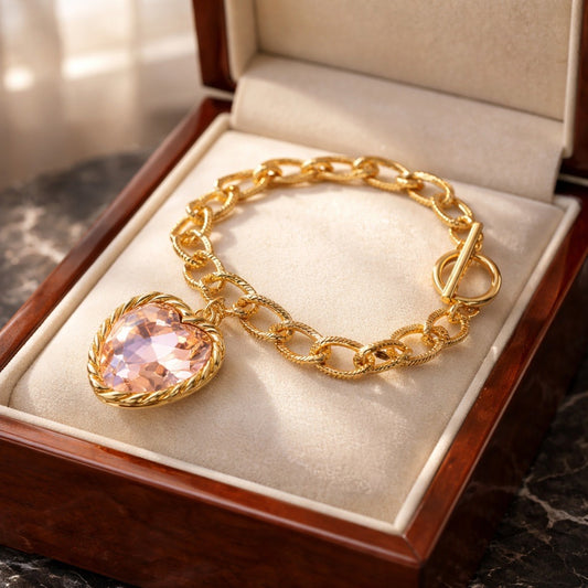 Gold tone chain bracelet with beautiful pink glass stone heart