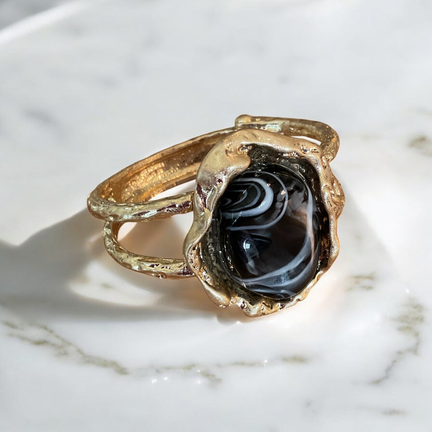 Large black stone set and gold statement bracelet