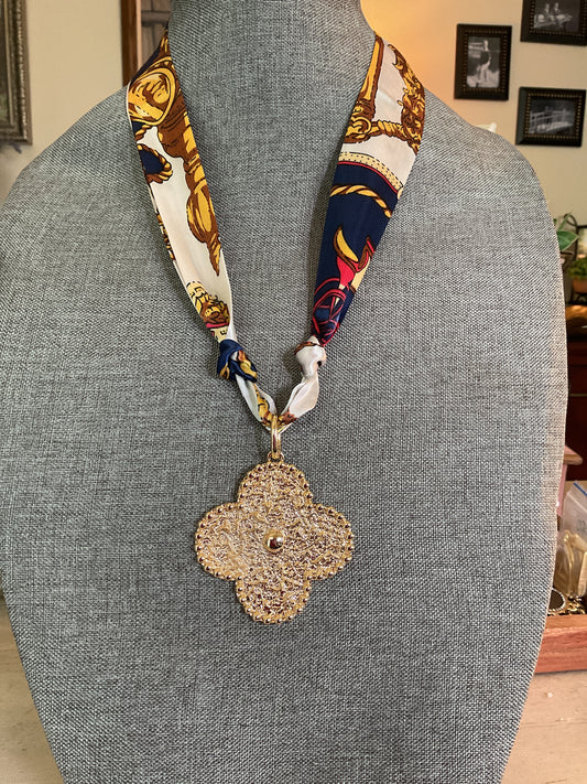 Navy gold and cream scarf, necklace with large gold, clover pendant