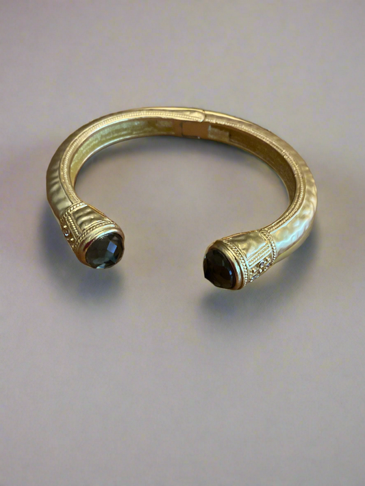 Gold cuff bracelet with black crystal accents