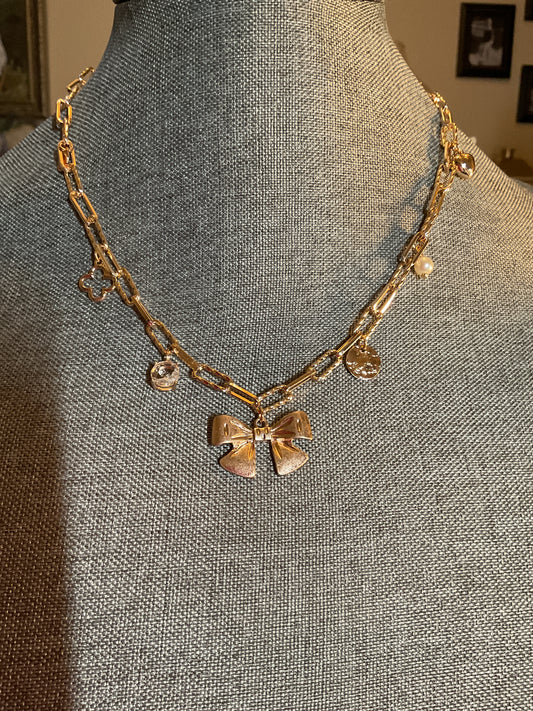 Gold link chain necklace with bow and Pearl charms