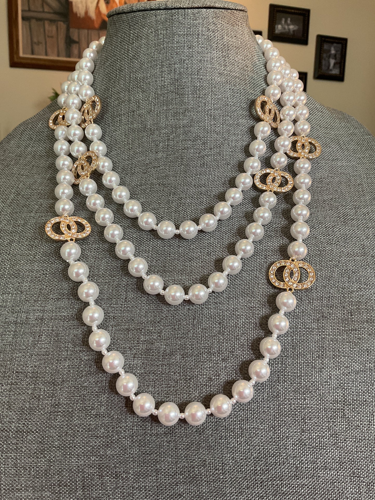 Multi layer pearl necklace with small rhinestone circle accents