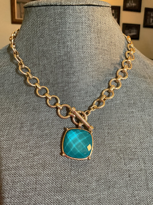 Beautiful turquoise color stone with gold chain, and toggle clasp