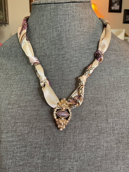 Beige, and purple scarf necklace with antique pendant