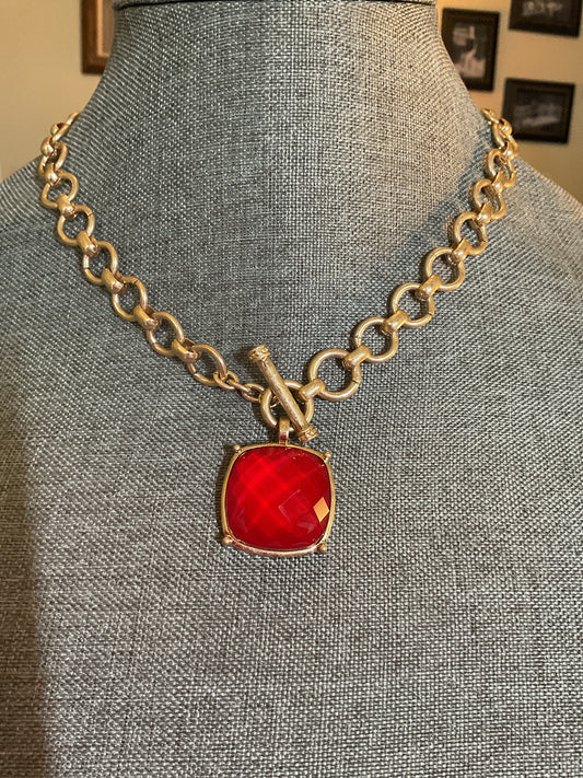 Stunning red stone pendant on a gold chain with a toggle clasp